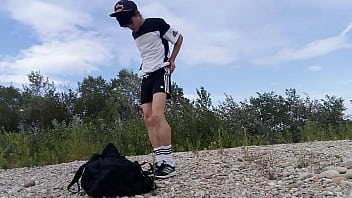 Super-cute lad Jon Arteen wears dark-hued Adidas outfit, flashes his underwear, ambles freeballing, draining off throught his brief shorts, nutting outdoor